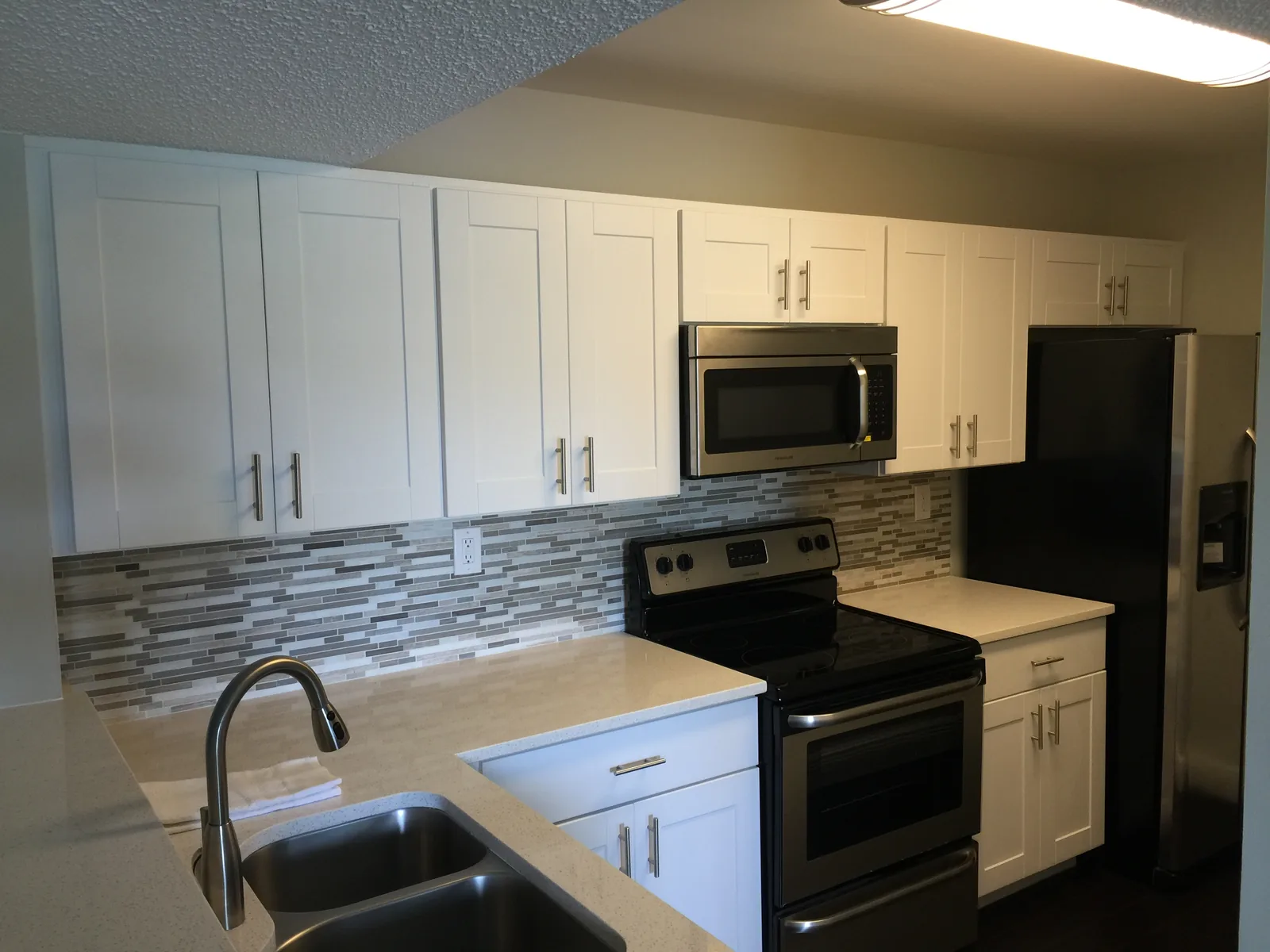 White kitchen renovated by Greco